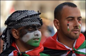 Protesters against military action in Gaza gather by the BBC building Saturday in central London.