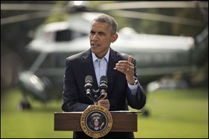 President Barack Obama speaks on the South Lawn of the White House today in Washington.