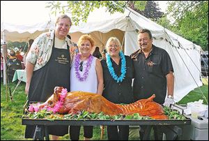 Hosts Sharon and Michael Sordyl with Tracy and Bruce Sabo at the luau.