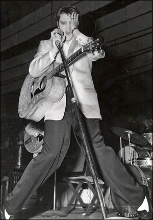 Elvis Presley performing on Nov. 22, 1956 at the Sports Arena in Toledo. 