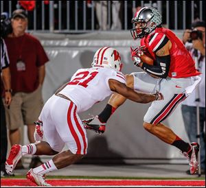 Devin Smith, right, has 1,572 yards receiving with 18 touchdowns in his career with Ohio State.