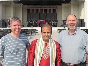 From left, Father Kent Kaufman, All Saints Roman Catholic Church, Rossford, Annat Dixit, the priest at the Hindu Temple, and Father Tim Philabaum, Zoar Lutheran Church, gather for a photo at the festival of India   