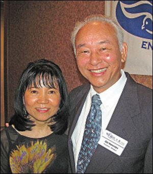 Theresa and Do Nguyen, board member and D.O.V.E. mission trip chairman, enjoy the organizationâs gala.