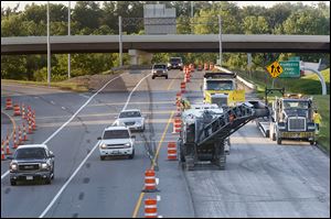 Kokosing Construction Co. crews remove pavement on southbound I-75 at the I-475 split in Toledo.