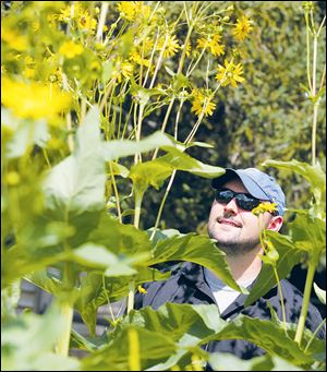 Michael Horst in his backyard garden in Toledo.