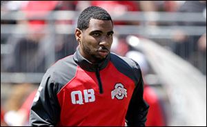 Ohio State quarterback Braxton Miller will miss the 2014 season after reinjuring his shoulder on Monday. OSU hands the reins to red-shirt freshman J.T. Barrett.
