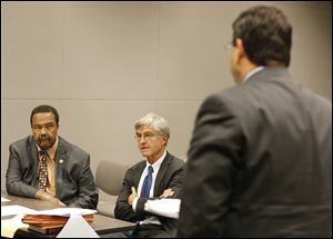 Jack Ford, left, answers questions from Lucas County’s hearing attorney J. Corey Colombo, right. At center is Mr. Ford’s attorney John J. Kulewicz.