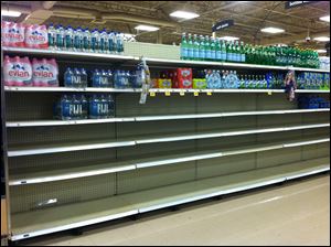 The shelves were nearly empty at this Kroger store earlier today on Miracle Mile in Toledo.