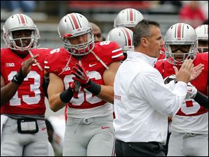 Urban Meyer will turn to redshirt freshman J.T. Barrett to lead the Buckeyes' offense after an injury to Braxton Miller.