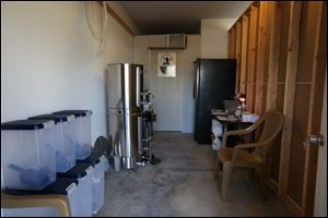 Chris Harris built this small, walled-off section in his garage to brew the beer.