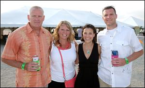 Left to right Tom Wiegand, Jodi Bostelman, Shannon Zacharias, and Bryan Zacharias during the Barefoot at the Beach party for the Boys and Girls Clubs.