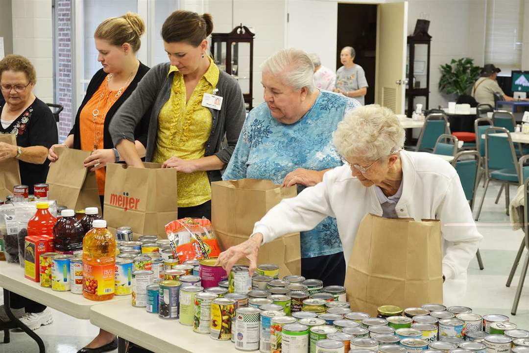 Snacks Giving Bags of groceries go to seniors in need - The Blade