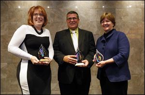 Award winners, from left: Janelle Metzger, Executive Director at Water for Ishmael, Rev. Dan Rogers, president and CEO Cherry Street Mission Ministries, and Lori Schoen, Executive Art Director, Shared Lives Studio,.