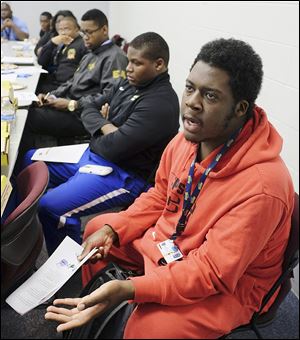 University of Toledo student Khalil Taylor speaks during a meeting with Brothers on the Rise, a group of UT faculty and staff who are mentoring minority students in the hopes of improving retention rates. 