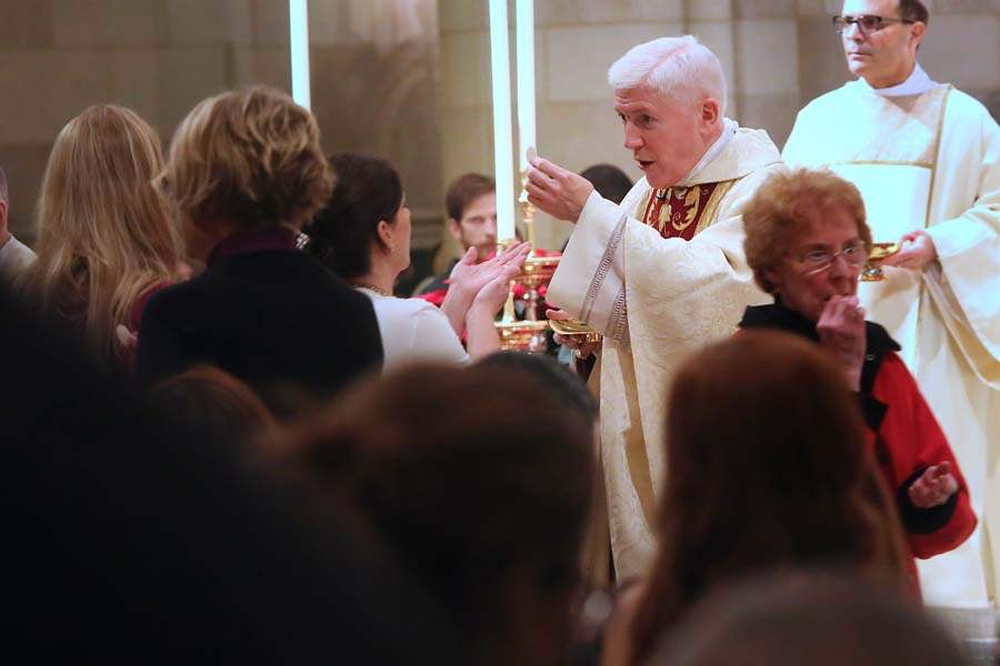 CTY-rosarymass25p-receiving-eucharist