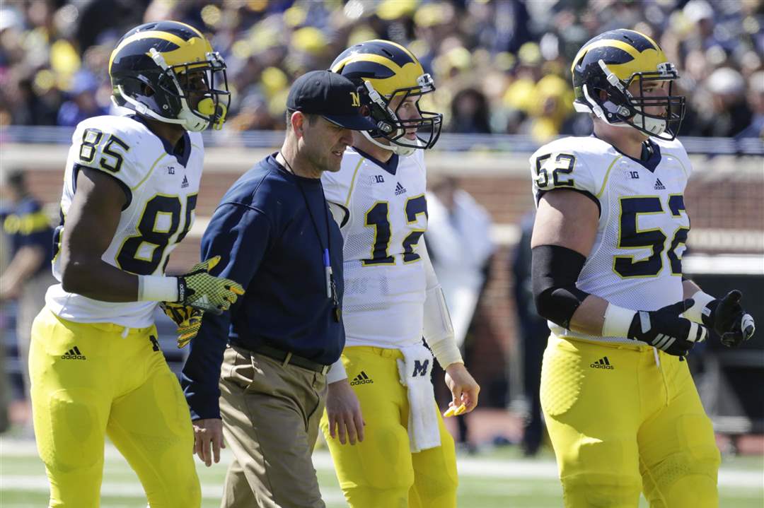 spt-michiganfb-coaching