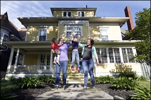 The Rye family, from left, Jane, 2, Jamie, Jonah, 5, and Kelly, lives in a 3,400-square-foot home on Glenwood Avenue that they to move into a  a 400-square-foot ‘tiny house.’