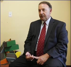 Dr. Richard Solomon, medical director of Mercy Autism Services in Maumee, developed PLAY therapy for autism.