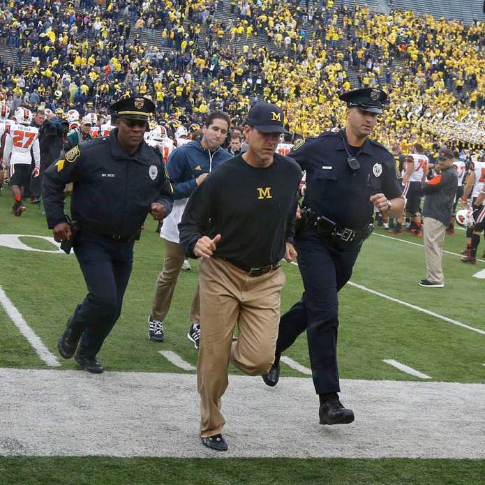 SPT-michigan-harbaugh-heads-offfield