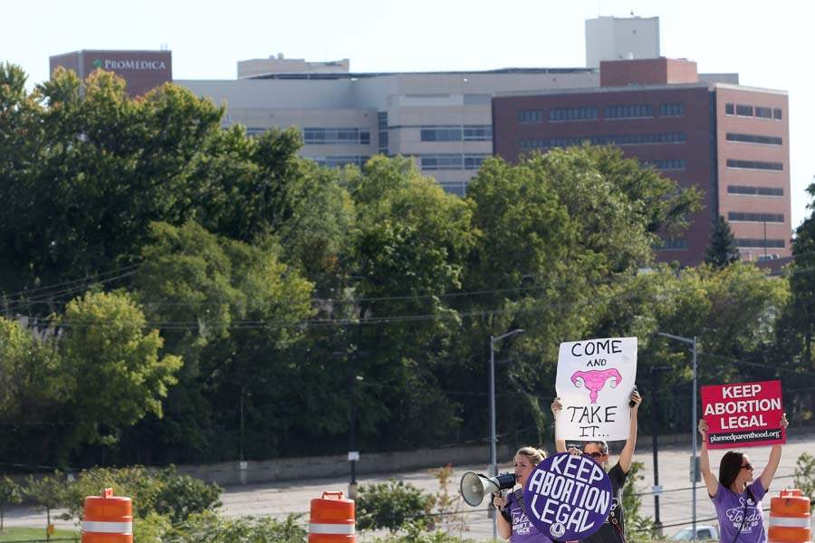 abortion16p-ainslie-hady-hady-signs