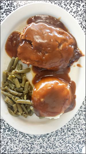 Meatloaf with mashed potatoes, gravy, and green beans from Monroe Street Diner.