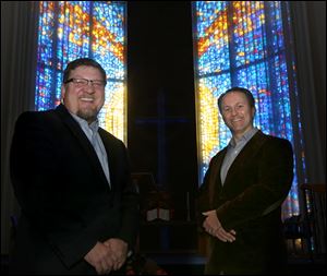 Pastor Daniel Bellavia, left, and author Steve Christie stand in the sanctuary of the First Baptist Church of Greater Toledo in Holland. Mr. Christie, a registered nurse, has published ‘Not Really “Of” Us,’ which grapples with the topic of children leaving the church.