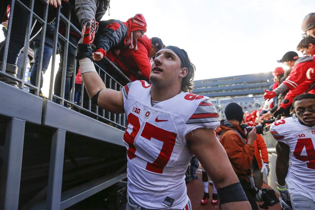 spt-OhioStateUM-high-five