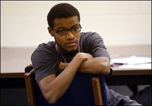 Stephan Beasley, of Columbus, listens to the discussion during a support class in the Defiance College's ASD Affinity Program for college students with autism on November 19, 2015.