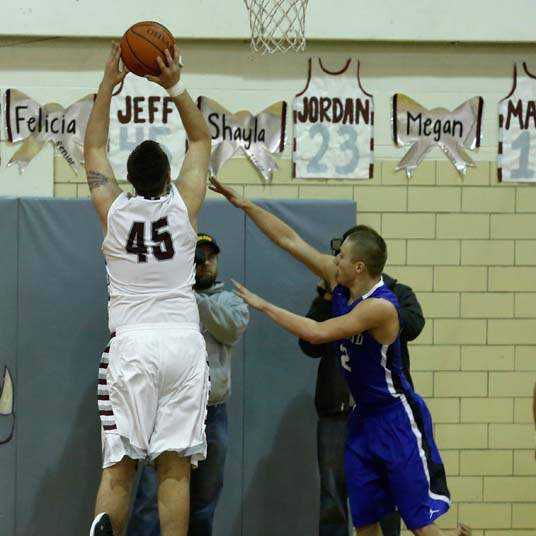 SPT-NBCboysbball16p-Rossford-s-Jeff-Hodak-draws-foul
