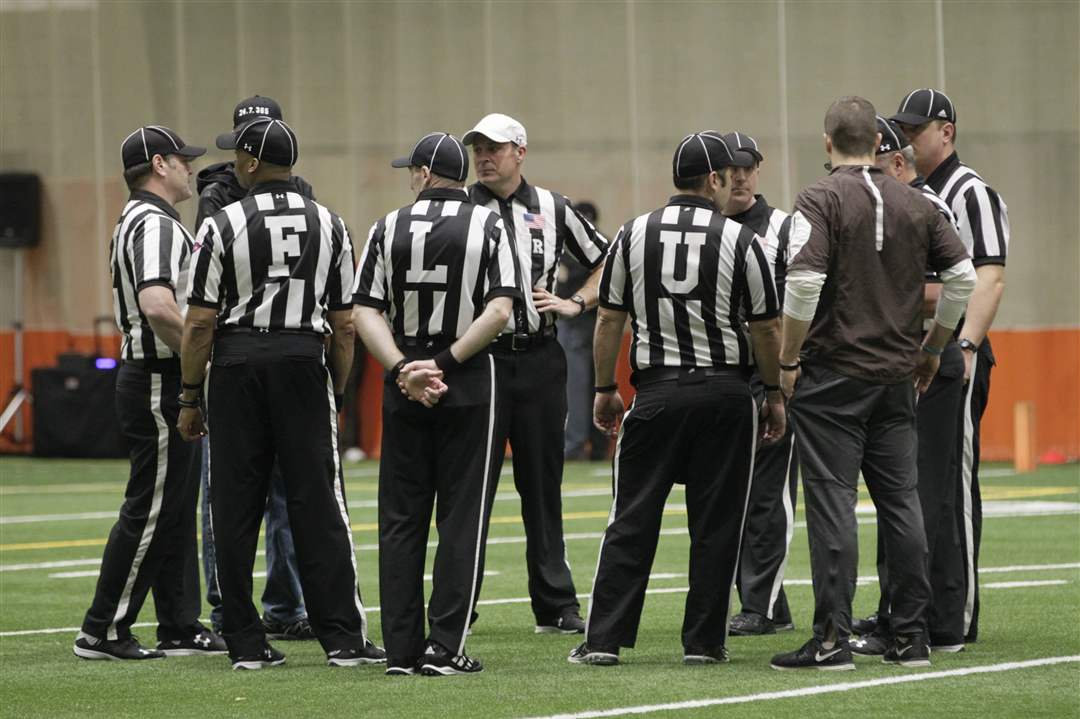 Officials-confer-4-2
