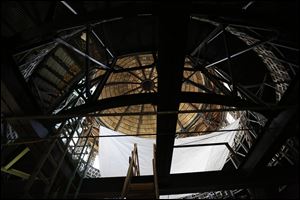 A white tarp hangs under the dome at the Lucas County Courthouse to collect the water that leaks through the dome.