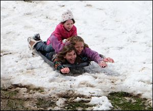 Youngsters took advantage of the April snow to go sledding at Pearson Park in Oregon. 