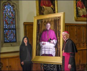 Leslie Adams and Bishop Daniel Thomas unveil Ms. Adams’ portrait of Archbishop of Hartford Leonard Blair at Our Lady, Queen of the Most Holy Rosary Cathedral, in Toledo. Archbishop Blair was the seventh bishop of the Roman Catholic Diocese of Toledo. Ms. Adams also painted Bishop James Hoffman. 
