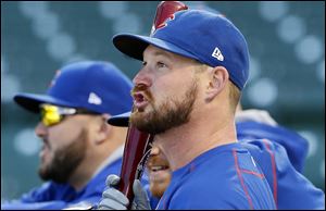 Former Chicago Cubs pitcher Travis Wood watches batting practice during a team workout during the 2016 playoffs. He signed a minor-league deal with Detroit this week.