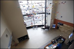 Dozens of colorful glass birds hang in the entryway to the Andrew and Karen Merrels Welcome Center. The birds, in colors representing various cancer support ribbons, are a gift from Mrs. Karen Merrels in honor of her husband, who died of cancer in 1994.