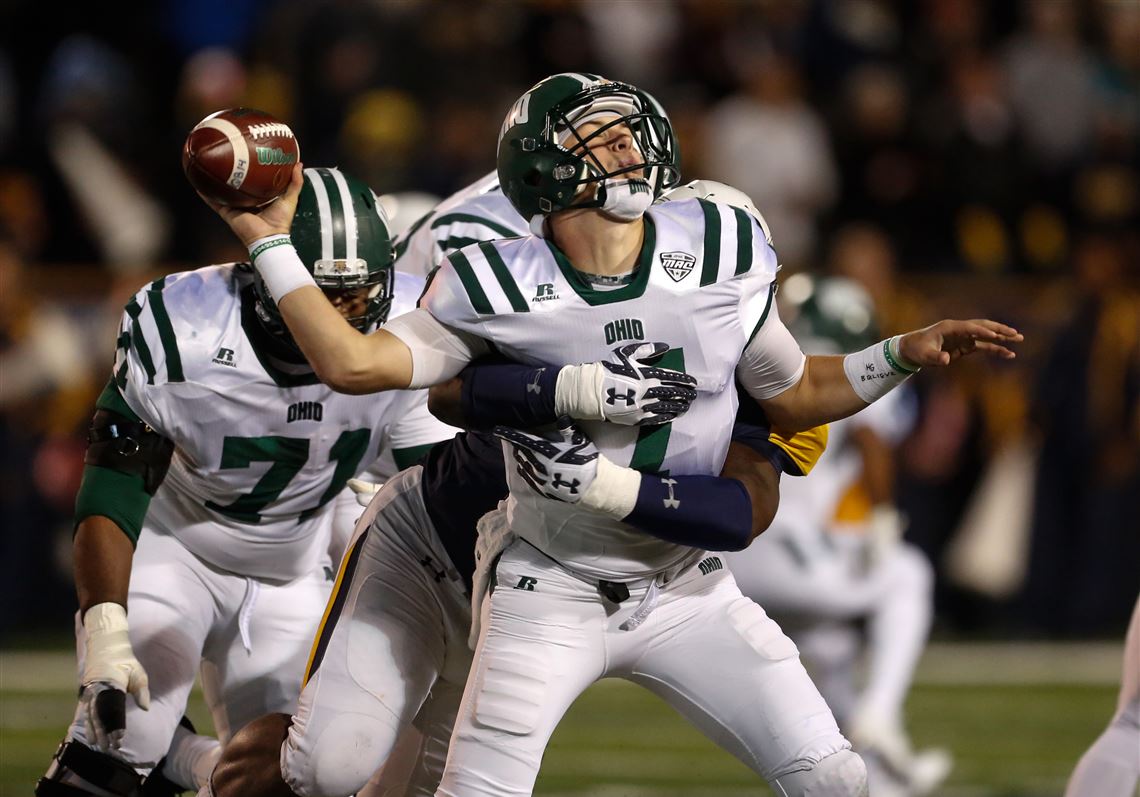 University of Toledo player Treyvon Hester drills Ohio University quarterback Quinton Maxwell in a game earlier this year.