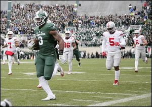 Michigan State's LJ Scott ran for 160 yards against Ohio State last season, but the Buckeyes escaped East Lansing, Mich., with a 17-16 victory.