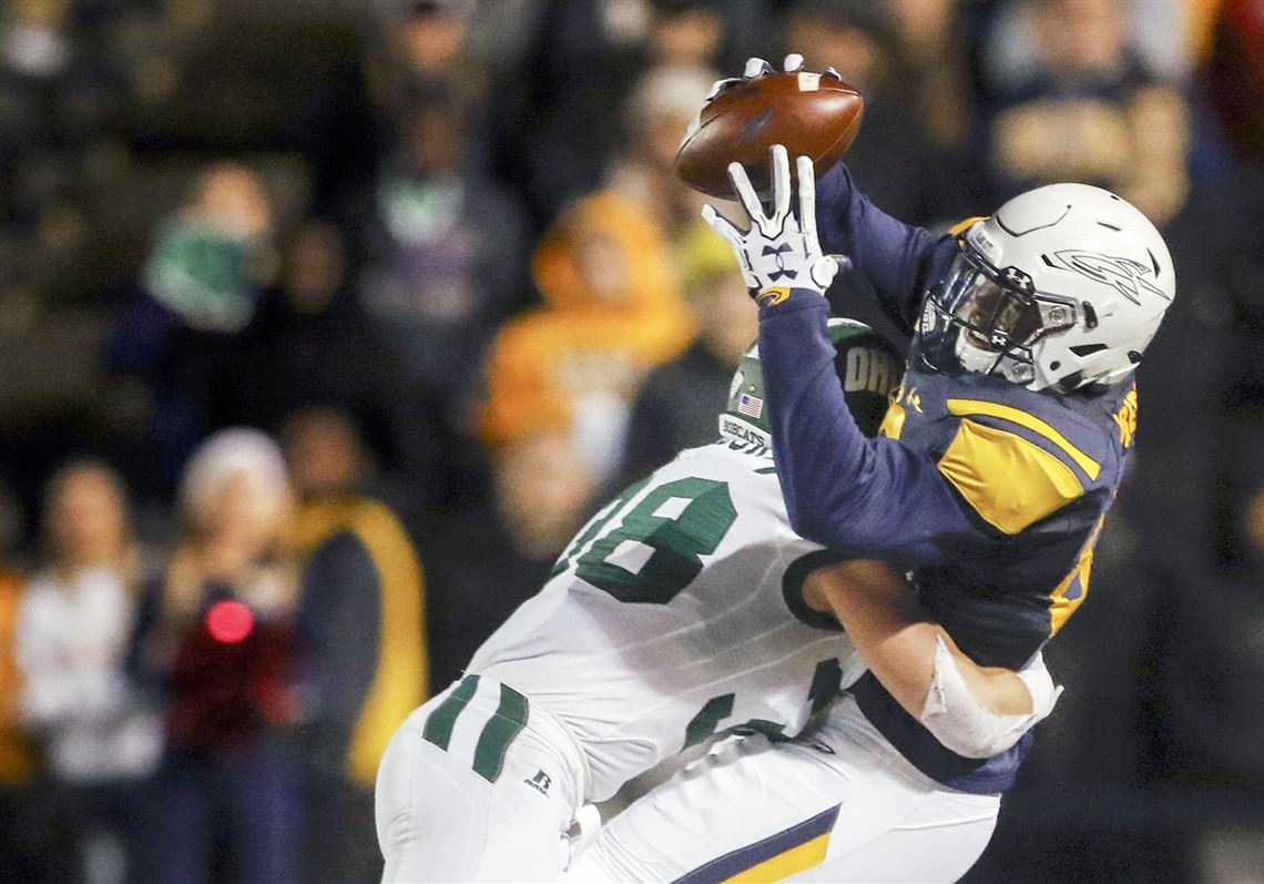 Former University of Toledo receiver Michael Roberts, making a catch against Ohio’s Chad Moore, is hoping to be chosen in the NFL draft in April.