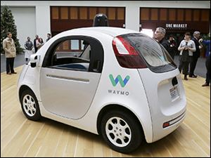 The Waymo driverless car is displayed during a Google event last year.