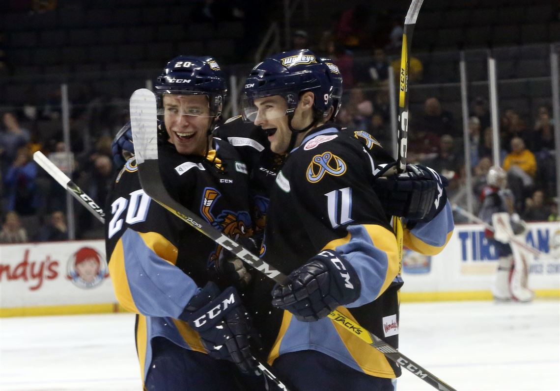 Nolan Zajac, right, and Mike Borkowski of the Toledo Walleye celebrate a goal last season. The Walleye have traded Zajac to Wichita and acquired the rights of forward Colin Martin from Utah.