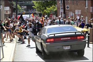 A vehicle with Ohio plates that is believed to belong to James A. Fields, Jr., drives into a group of protesters demonstrating against a white nationalist rally in Charlottesville, Va., Saturday.