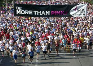 Participants start the course during the 2017 Komen Toledo Race for the Cure in downtown Toledo on September 24.