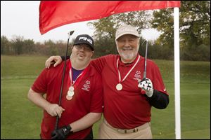 Tom King and Chris Cash compete in Unified Golf. They began golfing together five years ago and won the gold medal in the Special Olympics Ohio Summer Games in 2016.