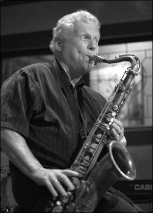 Gene Parker plays the saxophone.