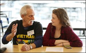 Army veteran William Hoot, 67, of Troy Township is interviewed by Brie Plotter, 17, at the Penta Career Center Friday, November 10, 2017 in Perrysburg Township.