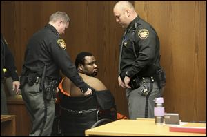 Jamaine Hill, 38, who is accused of shooting Detective Jason Picking in the face during a search warrant in West Toledo, appears for his arraignment in Toledo Municipal Court.