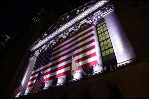 U.S. stock indexes edged higher in early trading Monday, Nov. 27, as traders returned from the Thanksgiving holiday. Banks and retailers were among the big gainers. Energy stocks lagged the most as crude oil prices headed lower. Several companies were also moving on deal news.