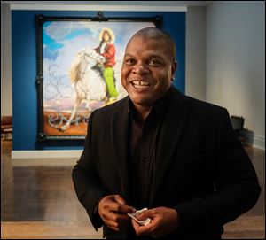 Artist Kehinde Wiley inside his exhibit 