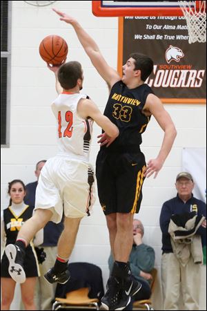 Northview's Colton Snow, shown making a block in a game against Southview last season, put up 13 points Saturday night for the Wildcats in a 55-42 win over Scott.