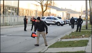 Toledo police investigate after shots were fired in the 4000 block of Bennett Road on Wednesday.  